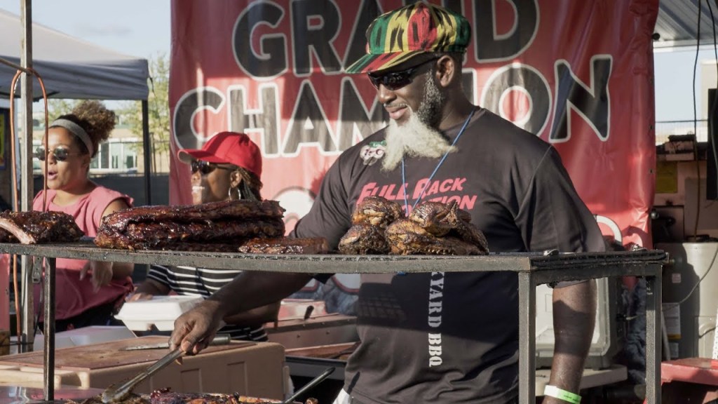 Man preparing Caribbean Food during a Street Festival